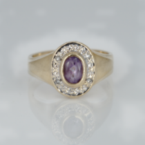 A 9ct gold, amethyst and diamond ring, 2.3g, K