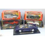 Five Burago model vehicles, four boxed