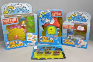 Three unopened boxed and original 'The Smurfs' toys from 1996, Talking Flip phone, Daisy Wheel 2-