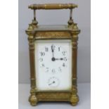 An early 20th Century brass and four glass sided carriage clock with alarm