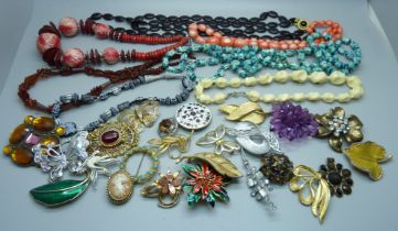 A collection of costume jewellery, necklaces and brooches