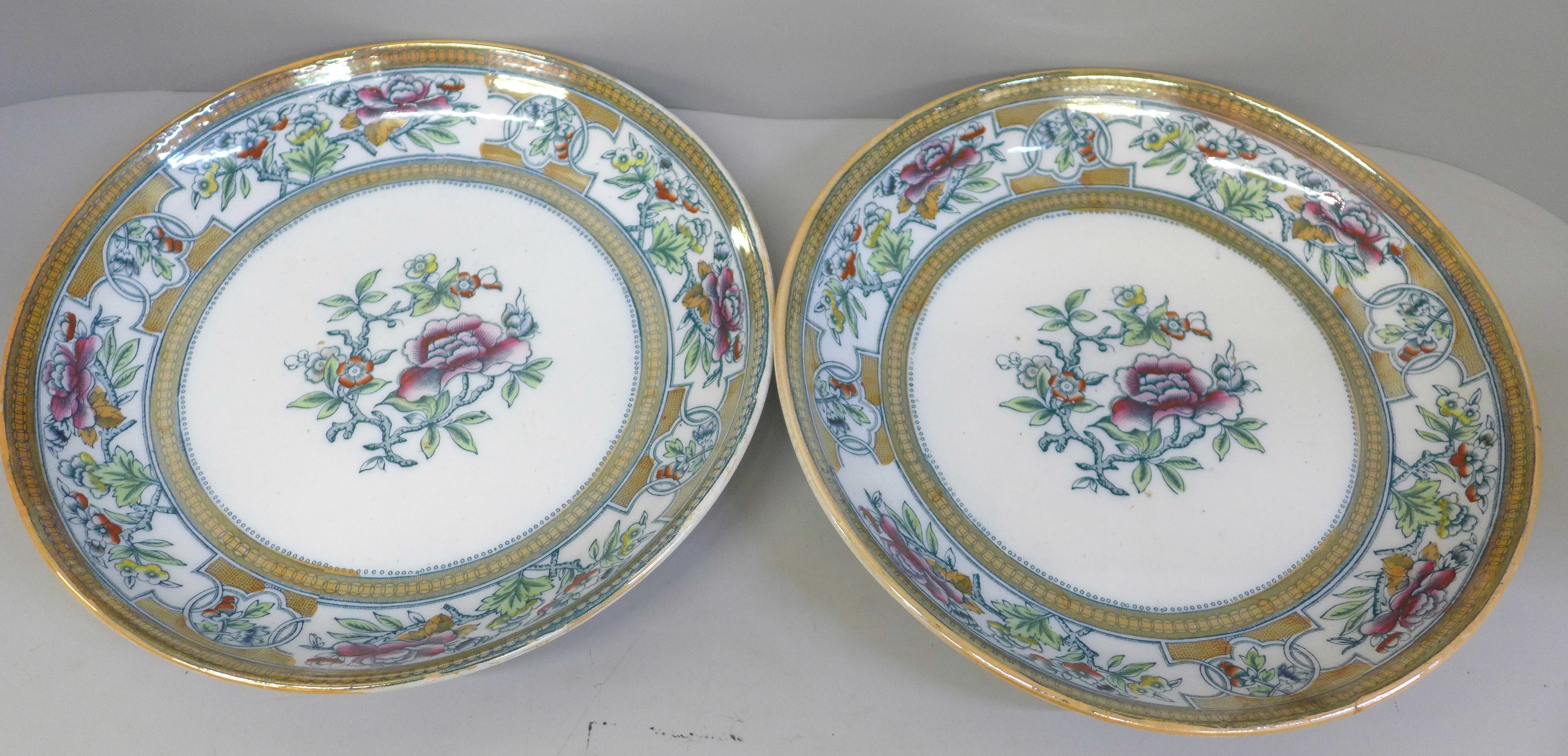 A pair of Edge, Malkin & Co. chinoiserie style 19th Century dishes, 27cm