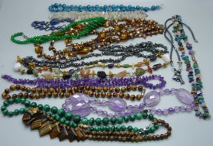 Twelve gemstone necklaces including silver mounted, tigers eye, amethyst, etc.