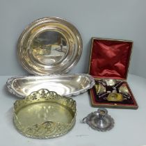 A cased set of four late Victorian plated salts, a chamber stick and two dishes on a stand/base **