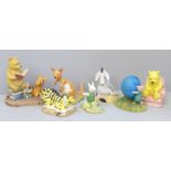 A collection of Royal Doulton and Border Fine Arts Winnie The Pooh figures