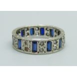 A wide white metal and blue and white spinel ring, 4.4g, P