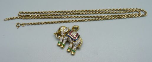 A yellow metal elephant brooch/pendant set with diamonds, sapphires and rubies, 13.2 g, with a 9ct