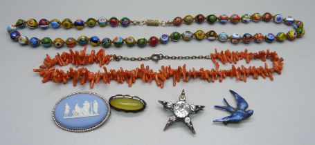 Three silver and silver mounted brooches, a paste star brooch, a coral necklace and a millefiori