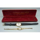A 9ct gold Excalibur wristwatch and a lady's 9ct gold cased wristwatch on a plated bracelet