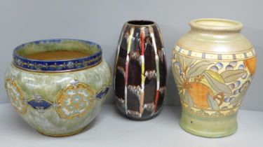 A Charlotte Rhead vase, hole for cable from lamp base, a German vase and a Doulton Lambeth Slater'