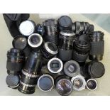 A box of twenty four camera lenses