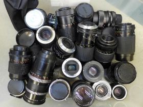 A box of twenty four camera lenses