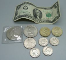 A Five Pounds coin, US coins including 1971 one dollar, half and quarter dollars, a two dollar