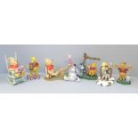 A collection of Disney Winnie The Pooh figures (7)