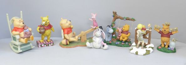 A collection of Disney Winnie The Pooh figures (7)