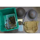A box of Army related items including two WWII helmets, 1914 Christmas tin, WWII bronze plaque,