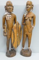 Two African carved wooden figures with bead jewellery
