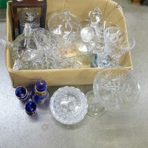 A collection of crystal and glass, including an Orrefors decanter, a crystal decanter in tantalus, a