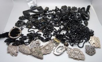 A collection of jet jewellery, a horse hair chain, buckles, etc.
