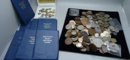 A collection of British coins including half-crowns, commemorative coins, pre-1947 half-silver