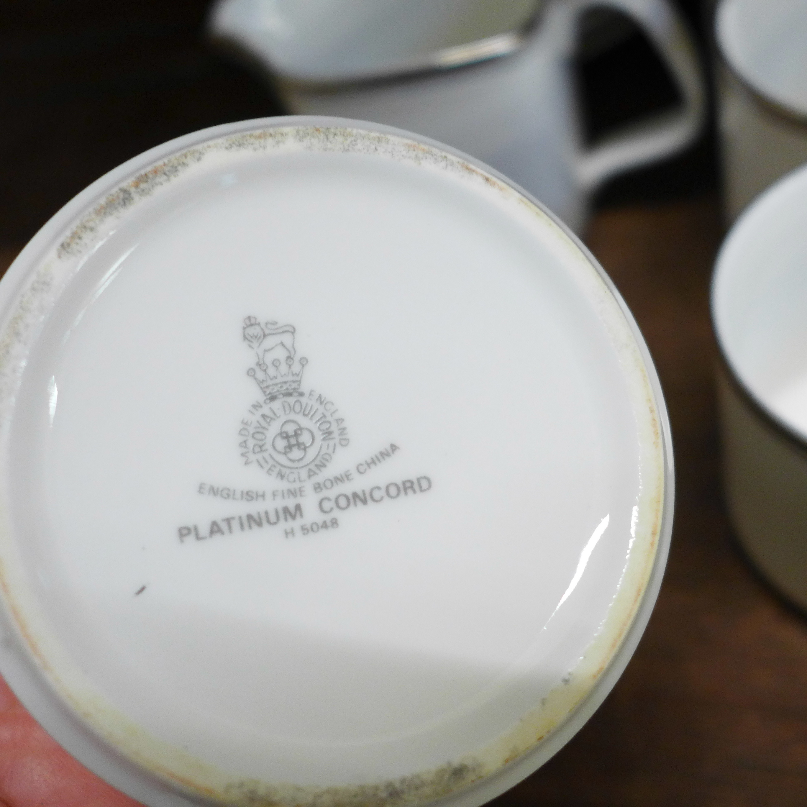 A Royal Doulton Platinum Concorde set comprising a coffee pot, milk jug, sugar bowl and six cups and - Image 3 of 4