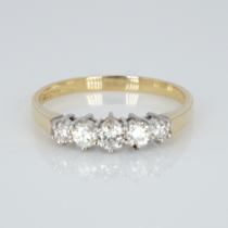 An 18ct gold and five stone diamond ring, 50pts marked on the shank, (0.5ct), ring size S, weight 3g