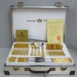 A Solingen canteen of cutlery, gold tone