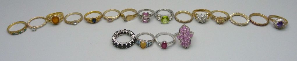 Four silver rings and fifteen other dress rings