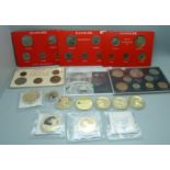 A collection of commemorative coins including gold plated, 1965 British proof set, a Queen