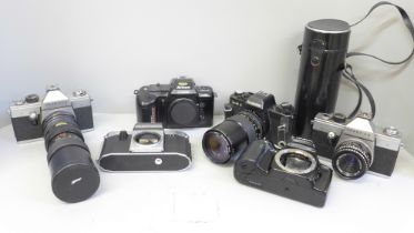 Six 35mm cameras including Rolleiflex, Praktica, Minolta and Nikon