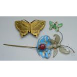 A Chinese hair piece ornament set with a cabochon stone, a green stone pendant and a Chinese