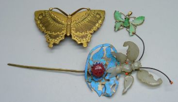 A Chinese hair piece ornament set with a cabochon stone, a green stone pendant and a Chinese