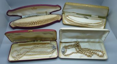 Four silver mounted pearl necklaces, including Lotus