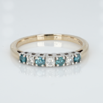 A 9ct gold seven stone two-colour diamond ring, 2.7g, S
