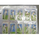 An album of ten complete sets of cigarette cards, including Players (Cricketers 1930, Game Birds and