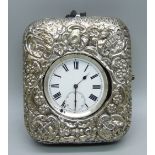 A silver pocket watch in a silver mounted travel case, a/f, case lacking back stand, second hand