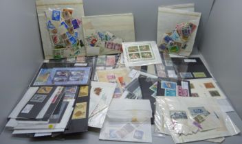 A collection of stamps on stockcards and in packets