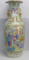 A 19th Century Chinese export famille rose baluster vase, decorated with panels of enamelled