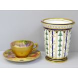 A Royal Worcester miniature cup and saucer, hand painted with fruit, the cup signed Ricketts and the