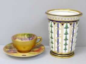 A Royal Worcester miniature cup and saucer, hand painted with fruit, the cup signed Ricketts and the