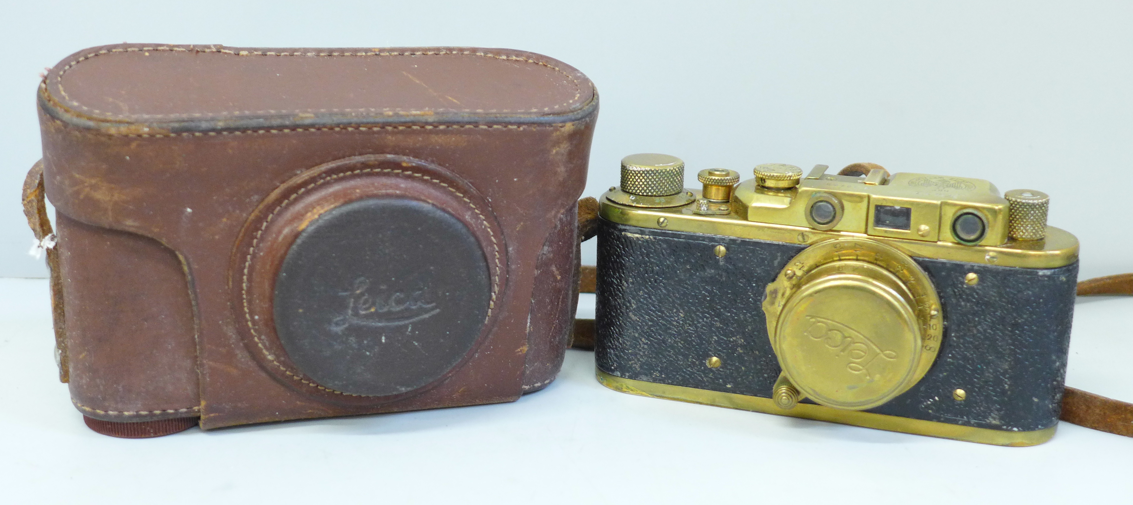 A Leica brass 1923 copy camera and leather case, made in Russia