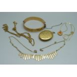 A 9ct gold metal core bangle, a rolled gold locket, a necklace, etc.