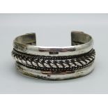 A heavy Egyptian silver bangle, 81g