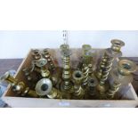 Ten pairs of brass candlesticks