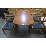 A teak drop leaf table and four chairs