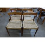 A set of four Danish Mogens Kold teak and paper cord seated dining chairs, designed by Arne