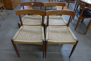 A set of four Danish Mogens Kold teak and paper cord seated dining chairs, designed by Arne