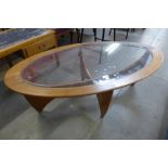 A G-Plan Astro teak and glass topped oval coffee table, a/f