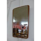 A teak framed mirror and a contemporary wall clock