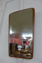 A teak framed mirror and a contemporary wall clock